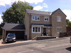 A single 4 bedroomed dwelling in reconstructed stone